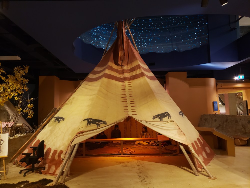A photo showing a large TIpi from The Story of the Blackfoot People Exhibit at the Glenbow Museum.
