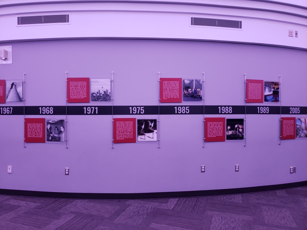 The photo shows the history of Calgary Tower on the interior wall on the observation deck.