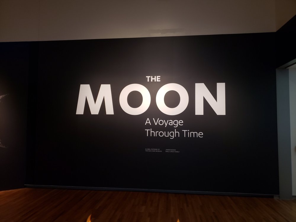 Photo of a signage. The Moon: A Voyage Through Time Exhibit at Aga Khan Museum. Photo Credit: Meimei